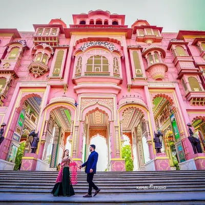 A breathtaking wide shot at the Patrika Gate in Jaipur. The grand scale and vibrant colors of the architecture make for an unforgettable, magazine-worthy pre-wedding photograph.