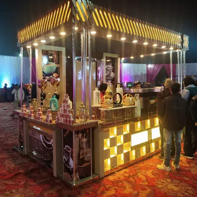 This is a full-scale, standalone coffee kiosk I provided for a large outdoor wedding. The 'V. Café Coffee' station is fully branded and lit, featuring professional espresso machines and baristas ready to serve guests.