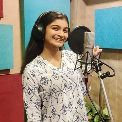 A smile of pure satisfaction after a great take. Being in the recording booth, with headphones on and the mic ready, is a feeling like no other. This was for a devotional track, and I felt truly blessed.