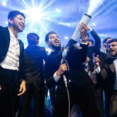 The groom and his friends having a blast with a CO2 gun on the dance floor.