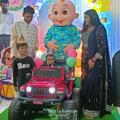 The birthday boy making a grand entrance in his toy car, greeted by our Cocomelon JJ mascot. This is the kind of special moment I love to create for a child's first birthday party.