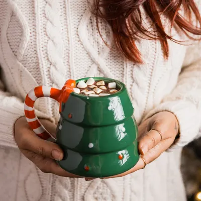 Capturing the essence of Christmas in a mug. This lifestyle shot of a festive hot chocolate mug is perfect for holiday-themed product photography.
