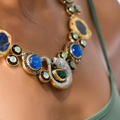A detailed macro shot is essential for jewelry photography. Here, the focus is entirely on the stunning craftsmanship of the necklace, capturing the sparkle of the diamonds and the deep blue of the lapis lazuli stones. This is the kind of clean, crisp shot needed for product listings.