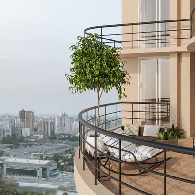 This expansive wrap-around balcony offers stunning city views. I designed it with multiple seating areas, including a comfortable rocking chair, to create different zones for relaxation and enjoying the outdoors.