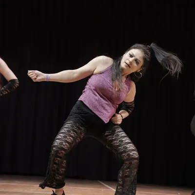 This action shot captures the power and energy of our adult performers. Our 'Sassy Girls' group brings incredible enthusiasm to the stage.