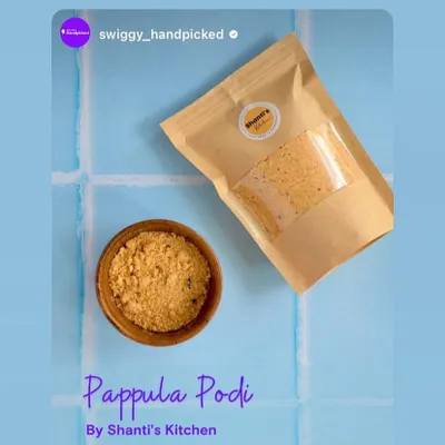 My Pappula Podi, also known as fried gram powder, is a classic South Indian staple. Here you can see its fine, flavourful texture in a bowl, ready to be enjoyed. The resealable packaging keeps it fresh in your pantry.