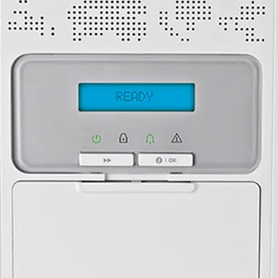 A close-up of a Visonic intrusion detection system panel, with the display screen showing a "READY" status. This indicates the system is armed and actively protecting your home with its advanced security features.