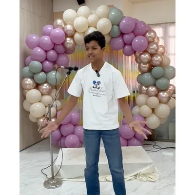 A student confidently delivers his speech during our public speaking presentation, using expressive gestures to engage the audience.