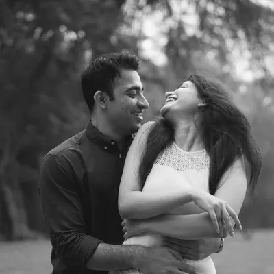 A black and white photo capturing a moment of pure, uninhibited laughter. These are the moments I live for, the ones that show the true heart of a relationship.