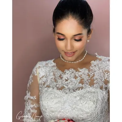A close-up of a soft and pretty look for a Christian wedding. I used peachy-pink tones on the eyes and kept the skin looking fresh and dewy for an angelic glow.