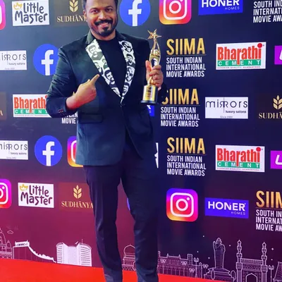 Director Pannaga Bharana on the red carpet at SIIMA 2021. I designed this blazer with a custom-printed lapel featuring the face of his dear friend Chiru, making it a deeply personal tribute.