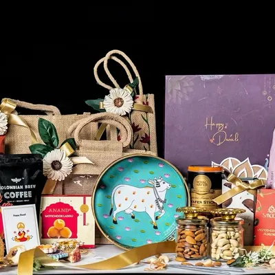 Our grand Diwali collection features a wide array of products to suit any corporate gifting need. This spread showcases various options, including jute bags, decorative trays, and gift boxes filled with coffee, popcorn, sweets, nuts, and festive items, demonstrating the breadth of our customizable solutions.