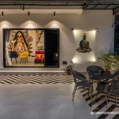 The view from the terrace looking into the family lounge. The large sliding glass doors create a seamless connection between the indoor and outdoor spaces, perfect for entertaining.