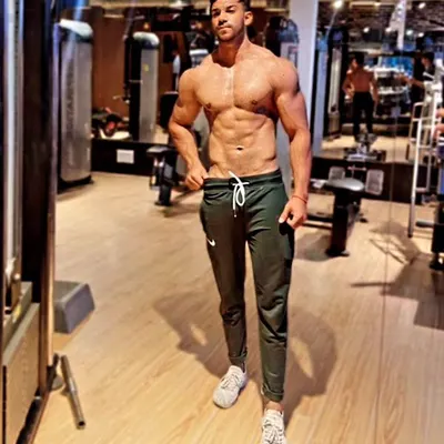 This is the level of conditioning we aim for. A lean midsection with visible abs and obliques is a sign of a disciplined diet and smart training, which are the cornerstones of my coaching philosophy.