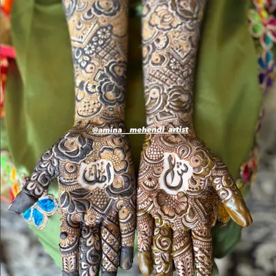 This design features the couple's initials hidden in the palms. It's a beautiful way to add a personal touch to your bridal mehendi.