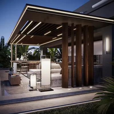 This backyard design features a stunning pergola that houses both a lounge and dining area. The vertical wooden slats provide a sense of enclosure and architectural interest, while the open design maintains a connection to the garden.