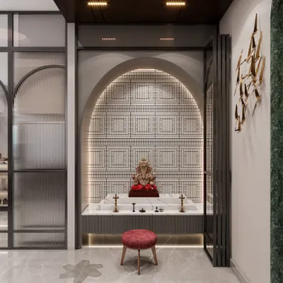 A beautiful pooja mandir set within an arched niche, featuring a backlit patterned wall and a Ganesha idol. The design uses folding doors to allow the space to be either open or enclosed, blending seamlessly with the home's modern interior.