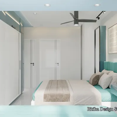 This is another angle of the modern teal bedroom, showing the relationship between the bed, the full-height white wardrobe, and the entry. The layered lighting, including recessed ceiling lights and a pendant lamp, ensures the room is well-lit and feels spacious.