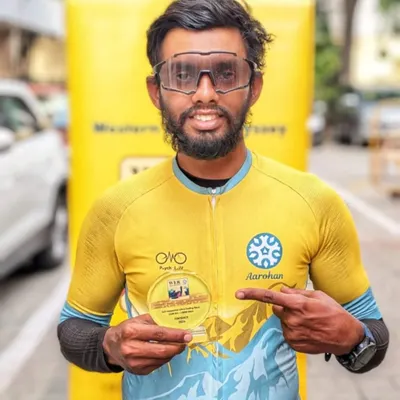 The spirit of our community is captured in rides like the Western Ghats Odyssey, a 1500km race with 19,000 meters of elevation. Here, a finisher proudly displays his trophy after conquering extreme weather and terrain to secure 4th place.