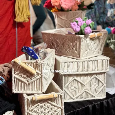 A collection of our macramé storage baskets in various shapes and sizes. Featuring wooden handles and intricate patterns, they are perfect for organizing everything from toiletries to craft supplies.