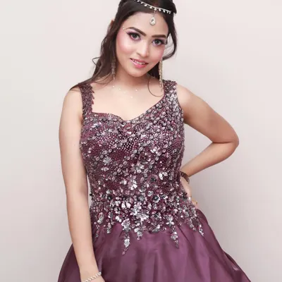 A beautiful studio portrait of a woman in an elegant, sequined gown. This type of session is perfect for capturing a glamorous look for a portfolio or special event.