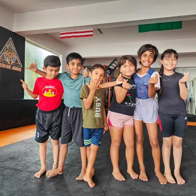 A happy crew of our young Jiu-Jitsu practitioners. Our classes for kids focus on building a strong foundation in grappling through fun, interactive exercises that teach discipline and teamwork.