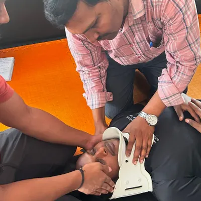 We practice life-saving skills with the same intensity as our combat skills. Here, our team learns how to properly stabilize a person with a potential neck injury during our first aid course.