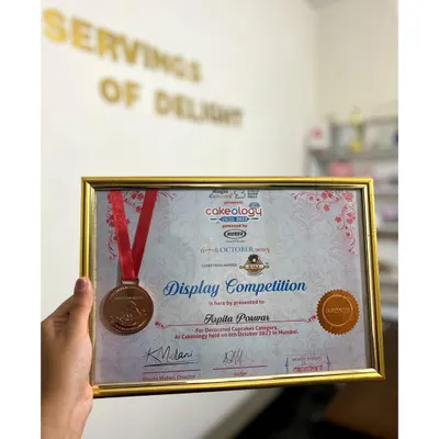 A proud moment for me. I was so excited to participate in Cakeology, India's largest cake show, and even won a medal in the cupcake display competition. This is more than a hobby; it's my passion.