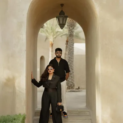 A powerful, fashion-inspired portrait taken under the arches of Al Seef, Dubai. The composition and styling create a look that feels like it's straight from a magazine cover.