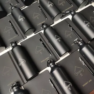 A complete corporate welcome kit featuring a personalized notebook, bottle, and pen. This set is perfect for making new employees feel valued from day one.