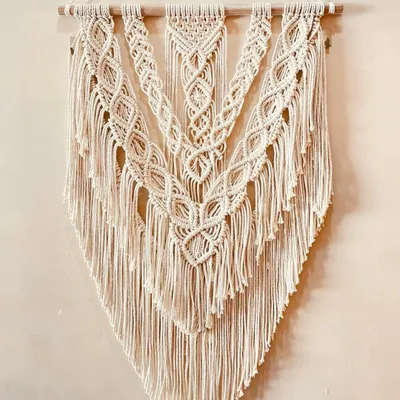 This large, V-shaped macrame hanging is a classic bohemian design. I used layers of intricate knots to create a sense of depth and texture, making it a perfect focal point for a living room or bedroom.