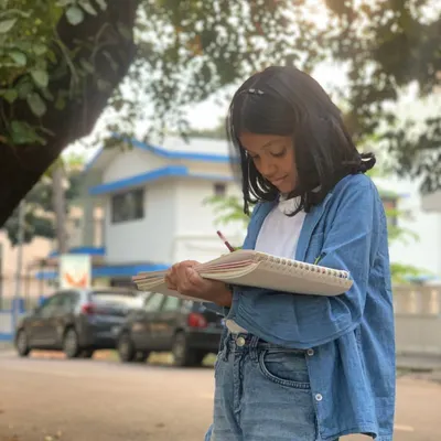 We take learning beyond the studio walls. An outdoor sketching session allows this young artist to connect with her environment, sharpening her observation skills and finding new subjects for her art.