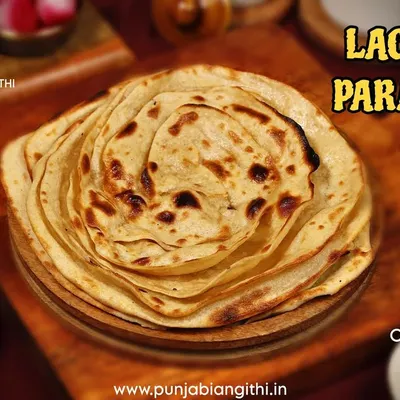 Look at the layers on our fluffy Laccha Paratha. It's the perfect bread to pair with any of our rich and flavourful curries.