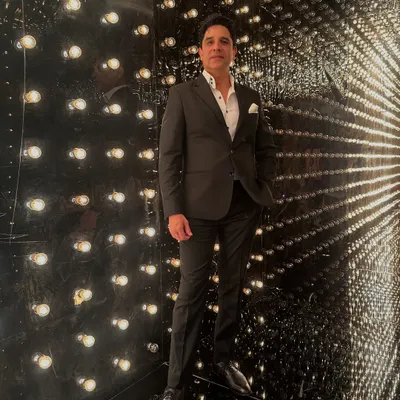 Dressed for the occasion and ready to set the mood. This is me in my element, surrounded by lights, ready for a night where the vibe will be just right.