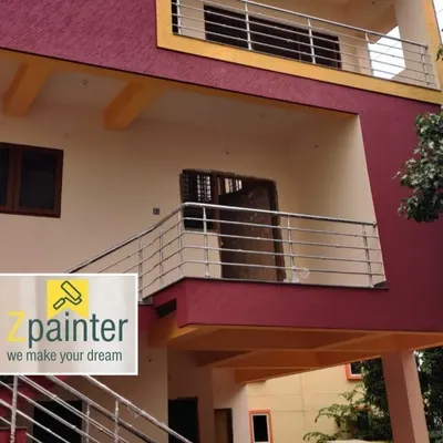 An example of our exterior painting services. This building features a durable, weather-resistant textured finish in a vibrant magenta, instantly boosting its curb appeal and providing long-lasting protection.