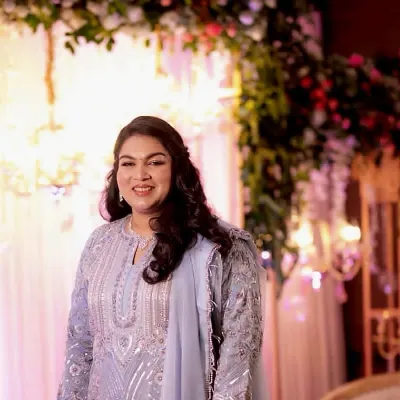 Our lovely client radiates elegance in a custom-tailored pure organza suit. The heavy Zardozi, sequins, and threadwork are beautifully captured in this candid moment.