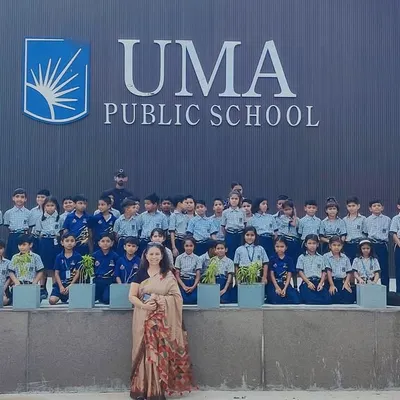 Students of Uma Public School gather for a group photo with our horses and instructors in front of the school, a symbol of our strong partnership.