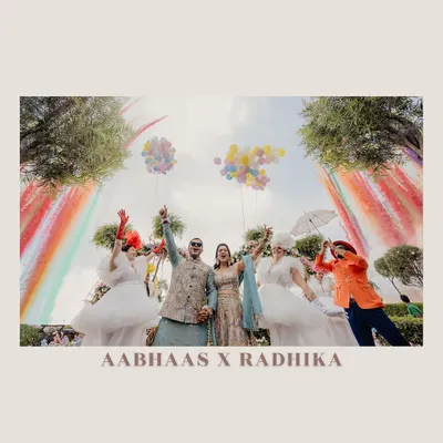 A Haldi ceremony that is bursting with color and joy. This shot captures the fun and playful spirit of the event, complete with rainbow decor and performers, creating a truly festive atmosphere.
