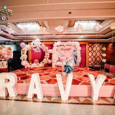 This was the main stage for baby Pravya's Cinderella-themed welcome ceremony. I used large, illuminated marquee letters, a balloon ring, and a custom backdrop to create a fairytale setting for her grand debut.