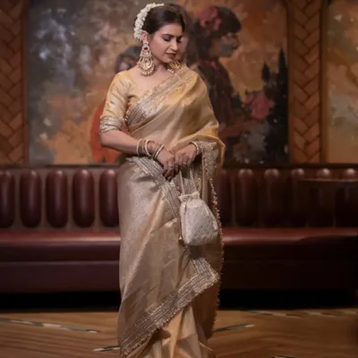 A tribute to the timeless beauty of Rekha ji. We recreated her iconic golden Kanjeevaram saree look, focusing on the classic makeup and a traditional floral bun.