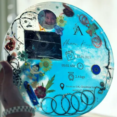 This custom baby details frame holds so much love. I preserved this little one's sonogram, first photo, birth details, and even their tiny silver bangles in a beautiful resin keepsake for the family to treasure.