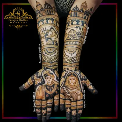 A complete bridal mehendi telling a grand story. This design includes portraits of the bride and groom, scenes with Shiv and Parvati, and architectural elements, all flowing together across both arms.