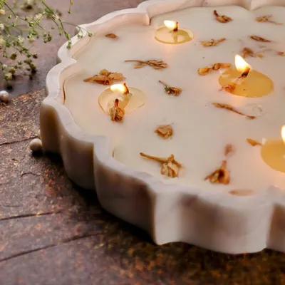 My Lotus Marble Urli Candle, a symbol of prosperity and grace, scented with divine mogra to fill your space with calm.