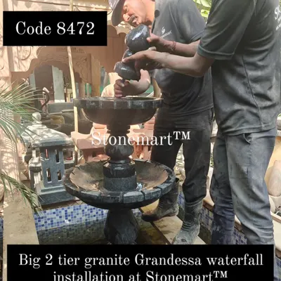 My team is shown here during the installation of a big 2-tier granite Grandessa waterfall. This demonstrates the hands-on process of setting up these large-scale pieces.