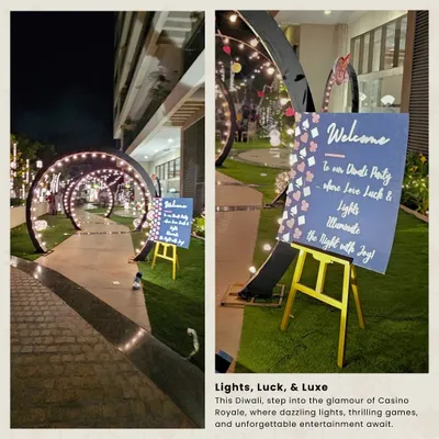 The guest experience begins at the entrance. For this casino-themed party, I created a welcoming pathway with twinkling light arches and a custom sign to set a glamorous and exciting tone for the evening.