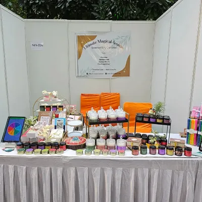 My full stall setup at a local exhibition. This shows the wide range of products I offer, from jar and tin candles to wax melts and festive items, all available for bulk and custom orders.