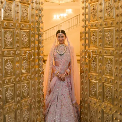 A bride's grand entrance is a moment of pure magic. I worked with Vibha to style her Anamika Khanna lehenga and the decor, ensuring her reveal through these magnificent golden doors at Mementos by ITC Hotels felt nothing short of royal.