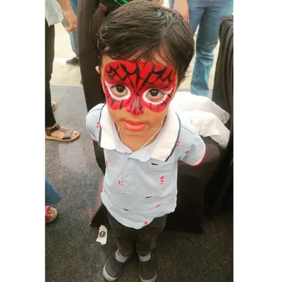 A classic Spiderman full-face transformation, always a huge hit at birthday parties! I use vibrant, safe red and black paint to create the iconic web design, making sure every child feels like a real superhero.