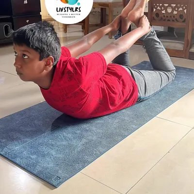 A young client demonstrates incredible strength and flexibility in Dhanurasana (Bow Pose). My kids' yoga classes focus on building a strong and healthy foundation for life.