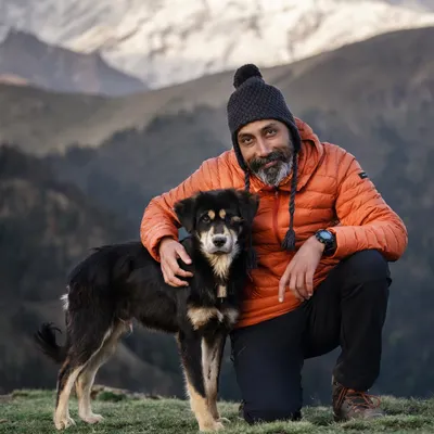 This is me with a friend I made in the mountains. My love for dogs is the foundation of my work. Every interaction, whether on a mountaintop or in a studio, is built on respect and a desire to connect.